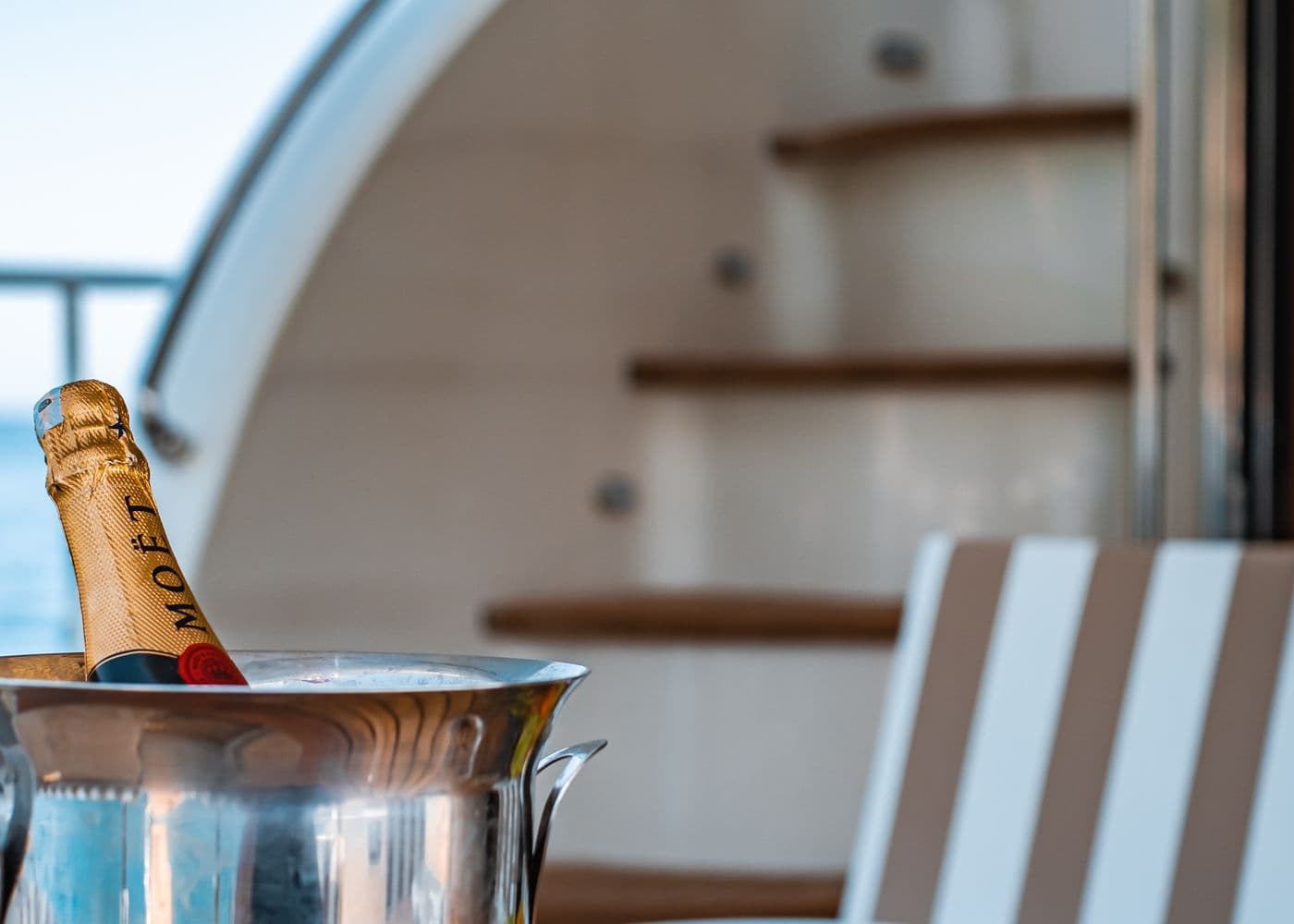 A chilled bottle set out on a yacht before guests arrive