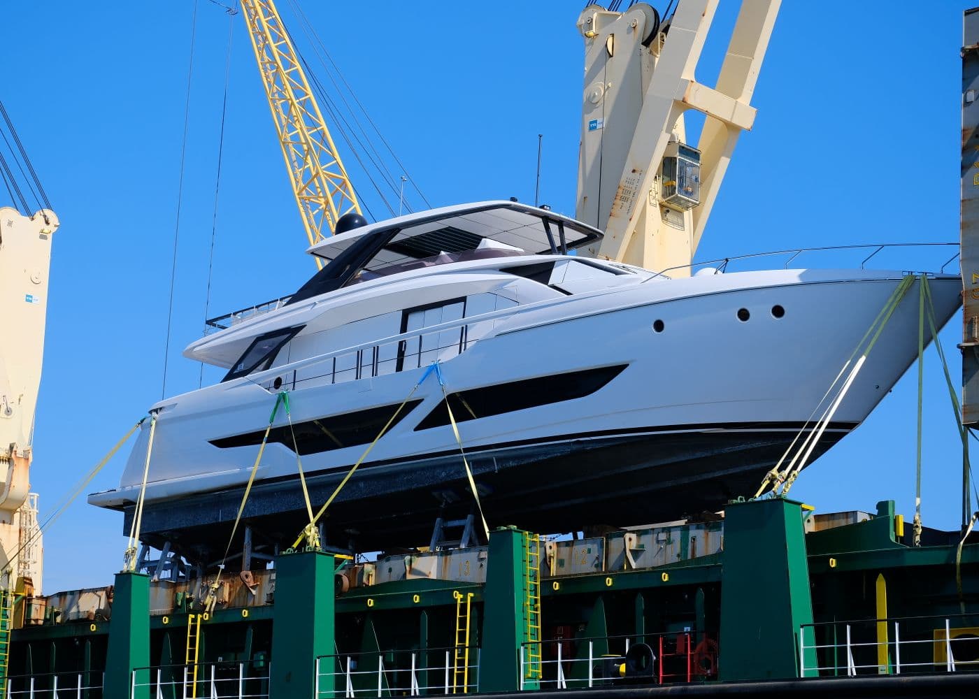 A yacht hauled out on a travel-lift for inspection