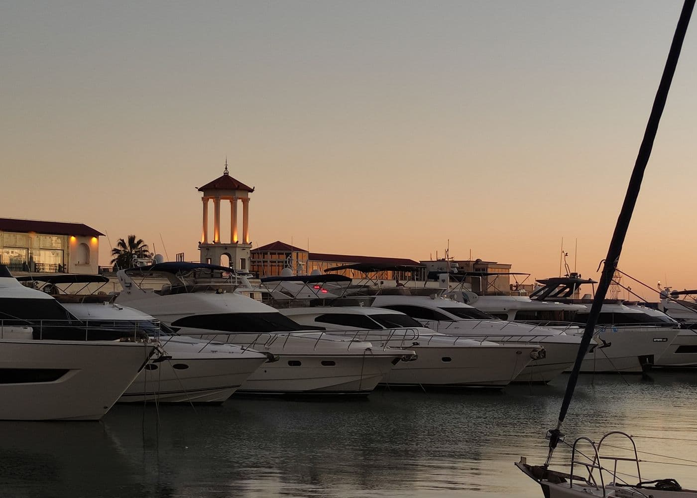 Motor yachts in a marina at dusk