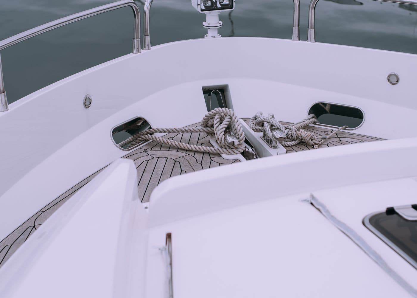 The clean white foredeck of a well-kept yacht